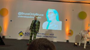 Bruce on stage at Agile Testing Days