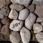Rocks with one saying "joy"